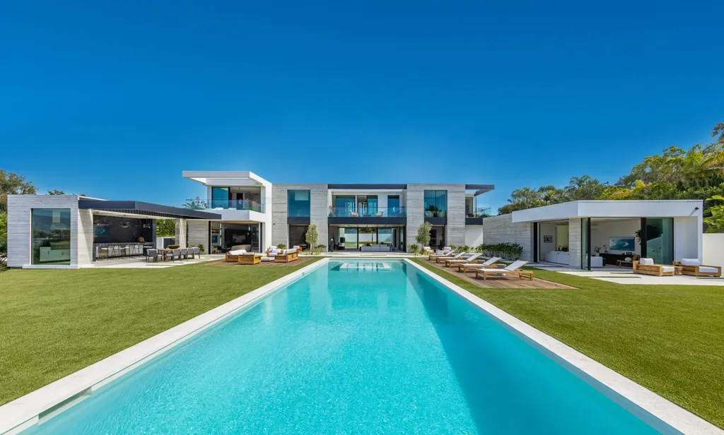 6889 Dume Drive Home in Malibu, California. Immerse yourself in the epitome of Malibu living with this newly completed 8,500 SF modern organic retreat in Little Dume. Developed and designed by Charles Kotliar and architect Doug Burdge, this ocean-view oasis offers 6 BD, 8 BA, customizations like board form concrete walls, oak woods, and curated stones. 