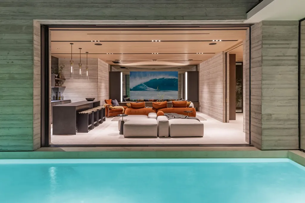 6889 Dume Drive Home in Malibu, California. Immerse yourself in the epitome of Malibu living with this newly completed 8,500 SF modern organic retreat in Little Dume. Developed and designed by Charles Kotliar and architect Doug Burdge, this ocean-view oasis offers 6 BD, 8 BA, customizations like board form concrete walls, oak woods, and curated stones. 