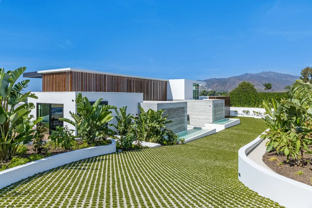 6889 Dume Drive Home in Malibu, California. Immerse yourself in the epitome of Malibu living with this newly completed 8,500 SF modern organic retreat in Little Dume. Developed and designed by Charles Kotliar and architect Doug Burdge, this ocean-view oasis offers 6 BD, 8 BA, customizations like board form concrete walls, oak woods, and curated stones. 