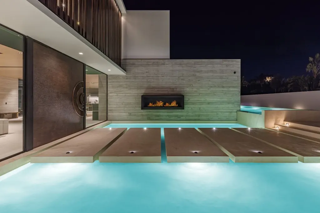 6889 Dume Drive Home in Malibu, California. Immerse yourself in the epitome of Malibu living with this newly completed 8,500 SF modern organic retreat in Little Dume. Developed and designed by Charles Kotliar and architect Doug Burdge, this ocean-view oasis offers 6 BD, 8 BA, customizations like board form concrete walls, oak woods, and curated stones. 