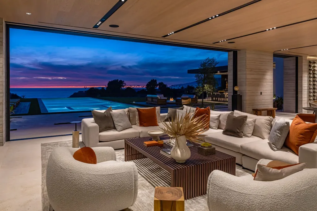 6889 Dume Drive Home in Malibu, California. Immerse yourself in the epitome of Malibu living with this newly completed 8,500 SF modern organic retreat in Little Dume. Developed and designed by Charles Kotliar and architect Doug Burdge, this ocean-view oasis offers 6 BD, 8 BA, customizations like board form concrete walls, oak woods, and curated stones. 