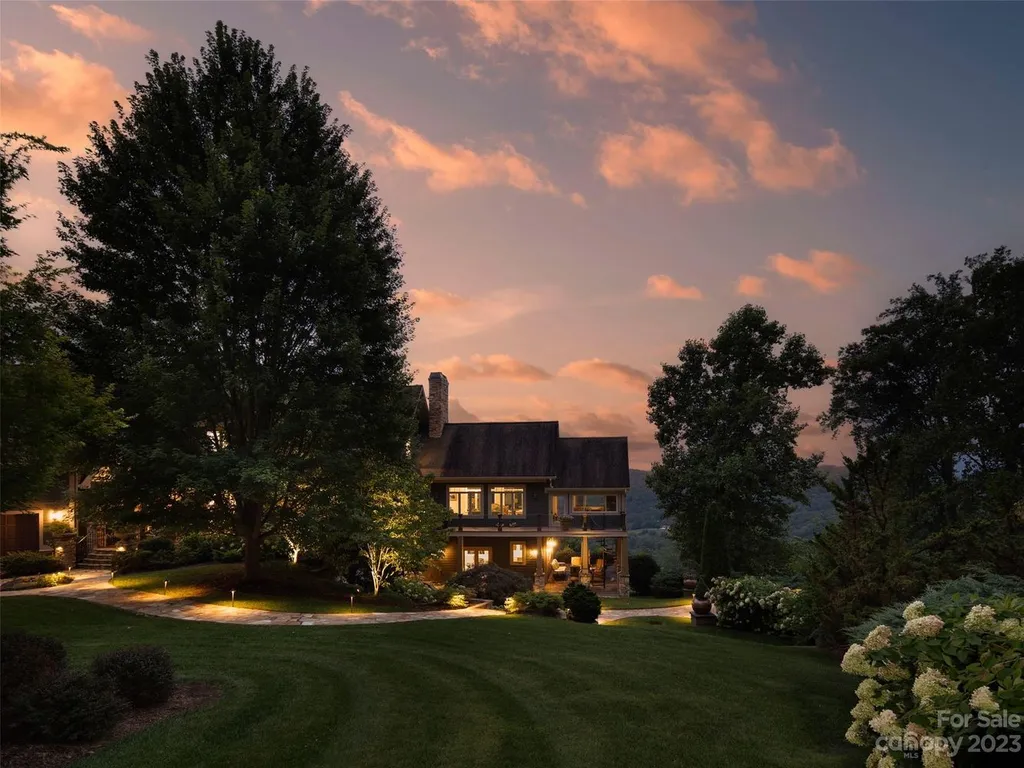 73 Crestridge Drive Home in Asheville, North Carolina. Discover the pinnacle of mountain living in this 7,000+ SF estate within the exclusive gated community of Poplar Ridge. Enjoy breathtaking long-range mountain views from the multi-level deck, infinity-edge pool, and hot tub. The main house features an updated kitchen, four new baths, terrace-level home theater, wine room, and more. 