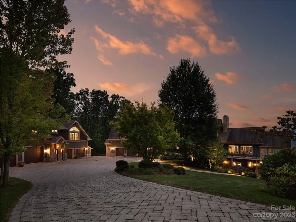 73 Crestridge Drive Home in Asheville, North Carolina. Discover the pinnacle of mountain living in this 7,000+ SF estate within the exclusive gated community of Poplar Ridge. Enjoy breathtaking long-range mountain views from the multi-level deck, infinity-edge pool, and hot tub. The main house features an updated kitchen, four new baths, terrace-level home theater, wine room, and more. 