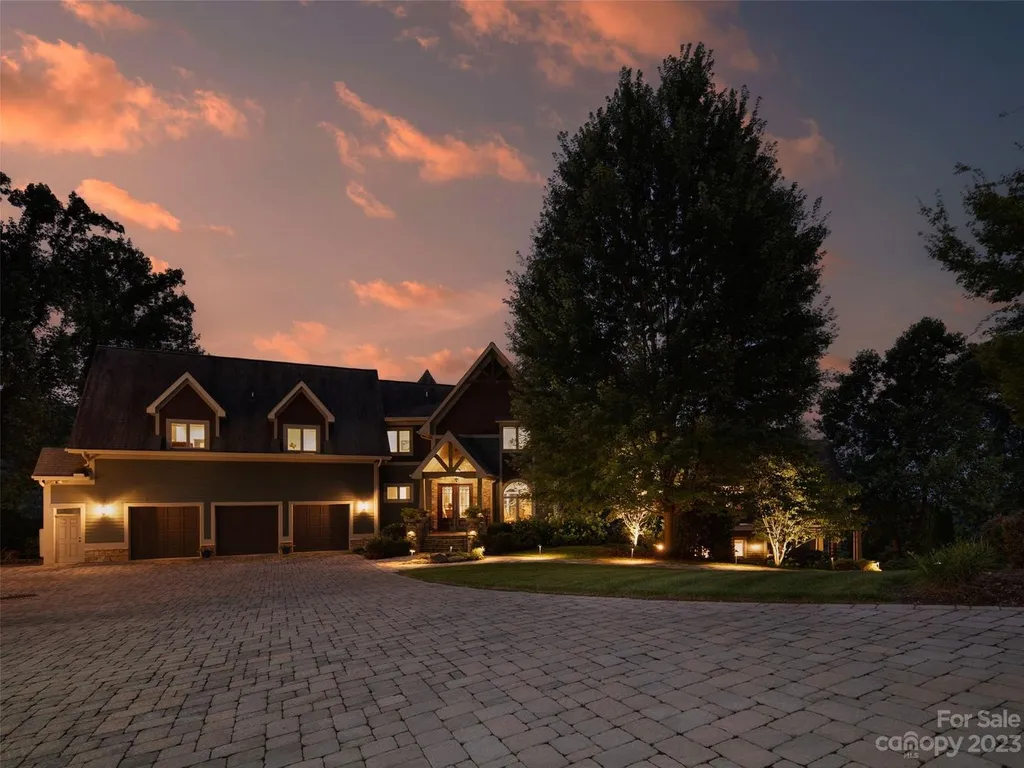 73 Crestridge Drive Home in Asheville, North Carolina. Discover the pinnacle of mountain living in this 7,000+ SF estate within the exclusive gated community of Poplar Ridge. Enjoy breathtaking long-range mountain views from the multi-level deck, infinity-edge pool, and hot tub. The main house features an updated kitchen, four new baths, terrace-level home theater, wine room, and more. 