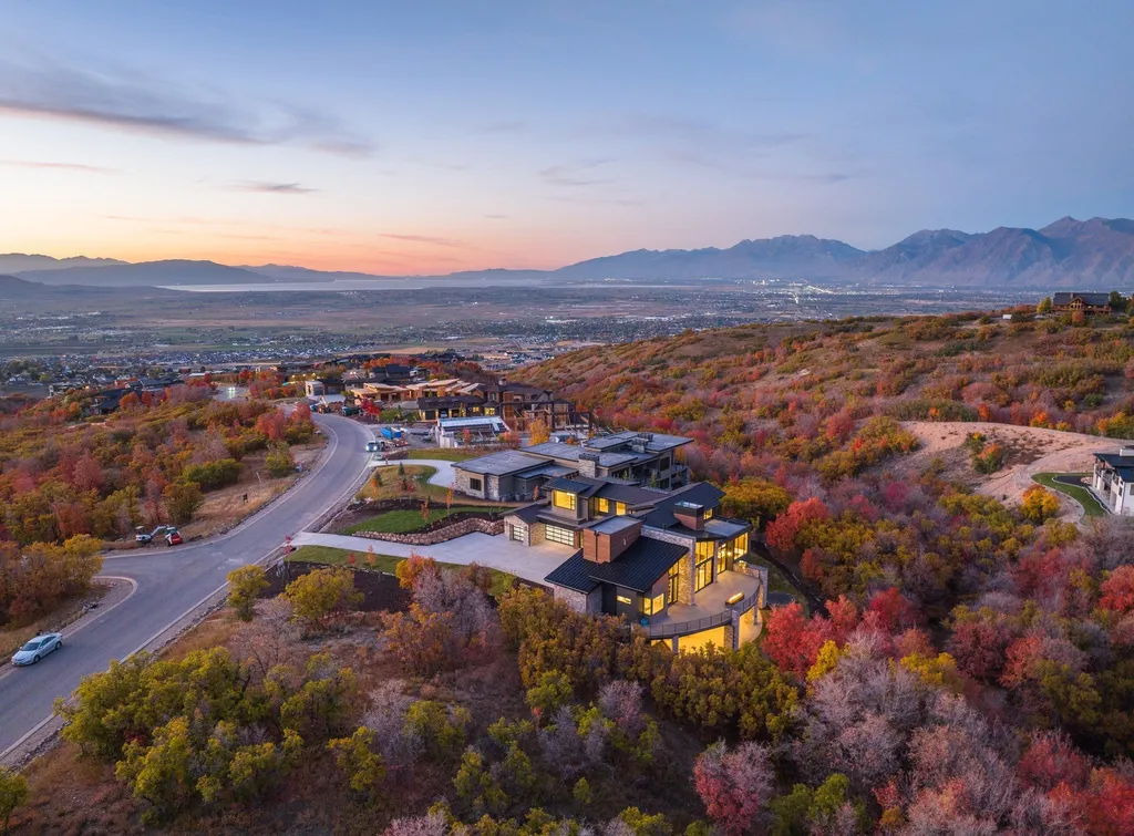 927 South Summit Creek Drive Home in Woodland Hills, Utah. Step into your custom dream home in Summit Creek, offering luxury living and unparalleled natural beauty. This magnificent residence, spanning 8,043 square feet on a .90-acre lot, presents stunning views of mountains and valleys. Floor-to-ceiling windows bathe the open-concept interior in natural light and provide uninterrupted scenic views. 