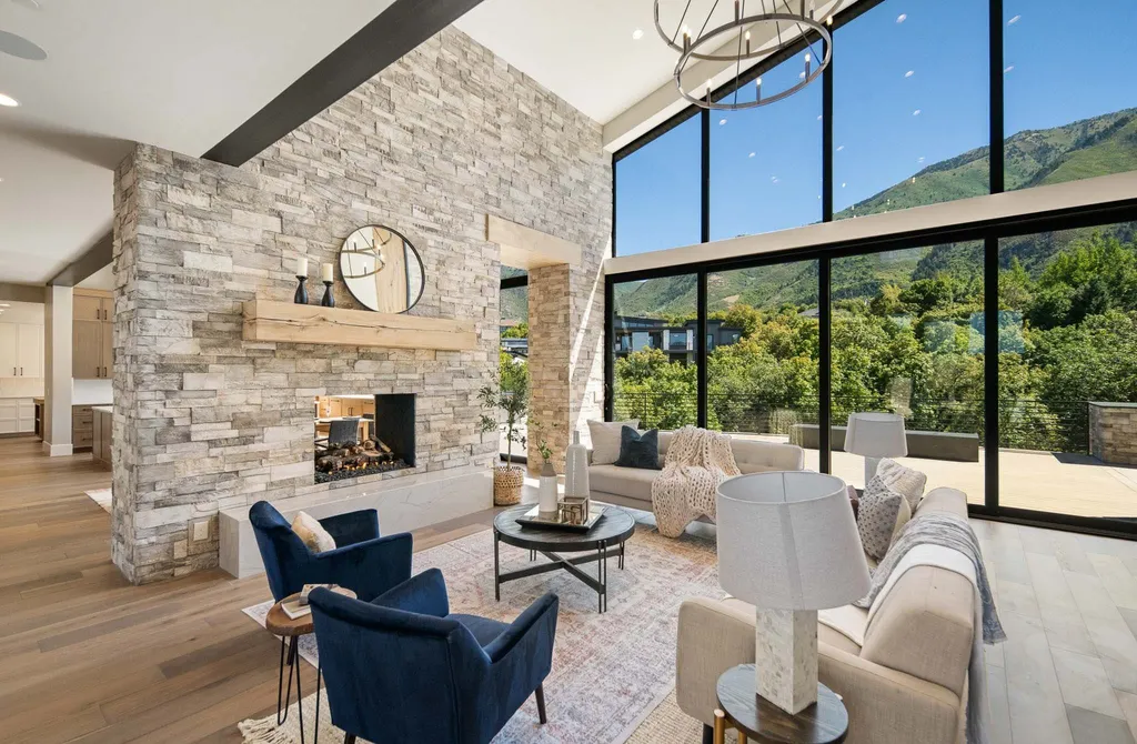 927 South Summit Creek Drive Home in Woodland Hills, Utah. Step into your custom dream home in Summit Creek, offering luxury living and unparalleled natural beauty. This magnificent residence, spanning 8,043 square feet on a .90-acre lot, presents stunning views of mountains and valleys. Floor-to-ceiling windows bathe the open-concept interior in natural light and provide uninterrupted scenic views. 