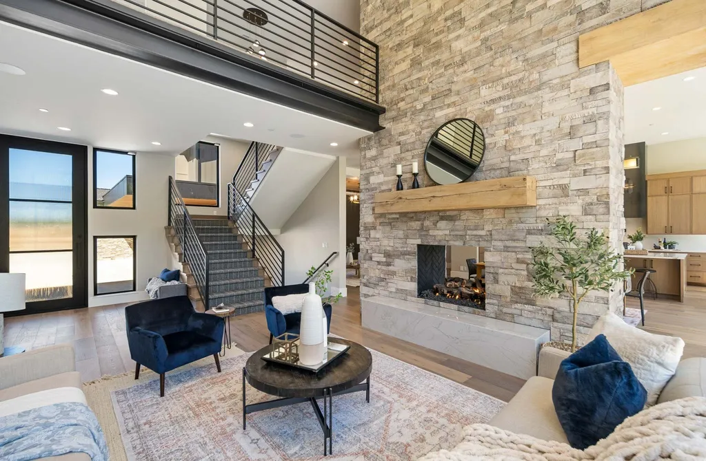927 South Summit Creek Drive Home in Woodland Hills, Utah. Step into your custom dream home in Summit Creek, offering luxury living and unparalleled natural beauty. This magnificent residence, spanning 8,043 square feet on a .90-acre lot, presents stunning views of mountains and valleys. Floor-to-ceiling windows bathe the open-concept interior in natural light and provide uninterrupted scenic views. 
