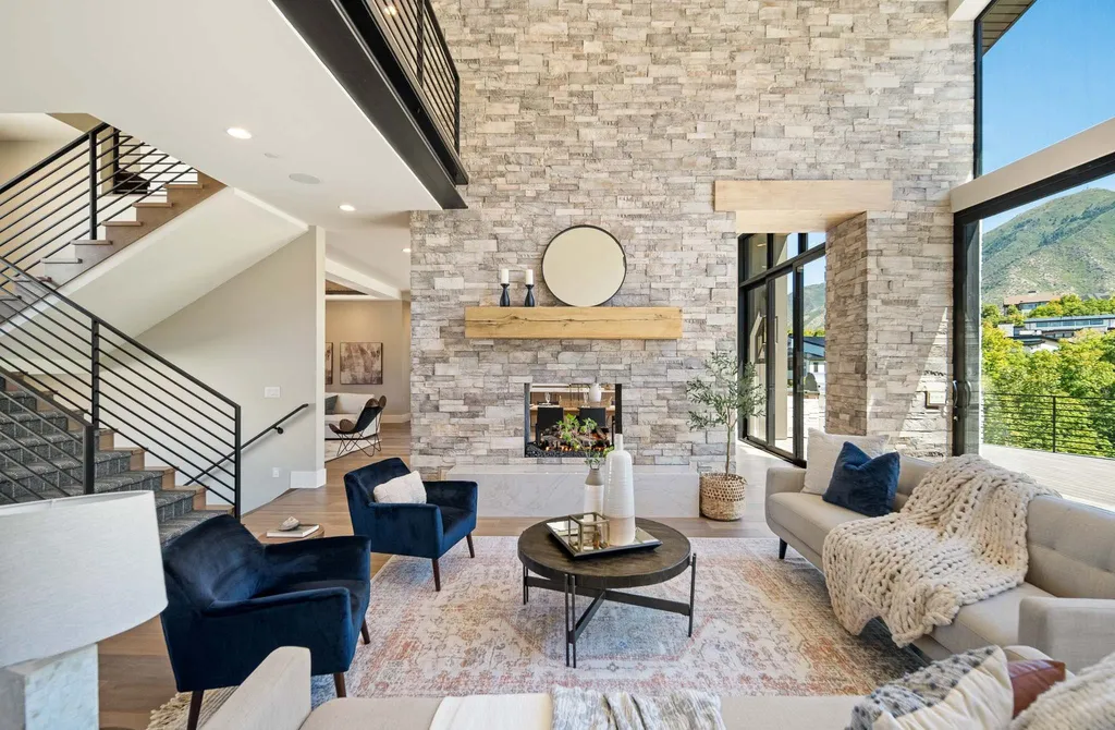 927 South Summit Creek Drive Home in Woodland Hills, Utah. Step into your custom dream home in Summit Creek, offering luxury living and unparalleled natural beauty. This magnificent residence, spanning 8,043 square feet on a .90-acre lot, presents stunning views of mountains and valleys. Floor-to-ceiling windows bathe the open-concept interior in natural light and provide uninterrupted scenic views. 
