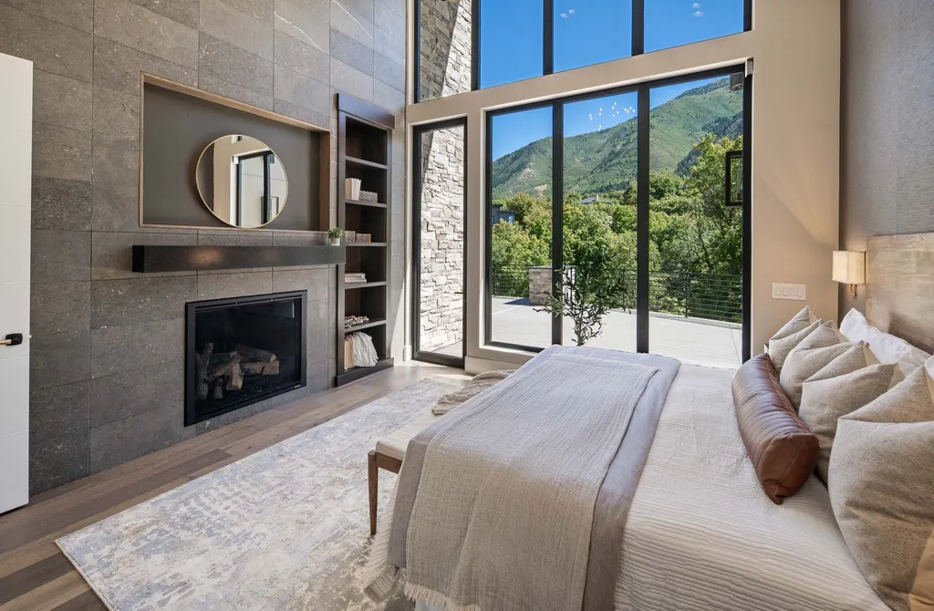 927 South Summit Creek Drive Home in Woodland Hills, Utah. Step into your custom dream home in Summit Creek, offering luxury living and unparalleled natural beauty. This magnificent residence, spanning 8,043 square feet on a .90-acre lot, presents stunning views of mountains and valleys. Floor-to-ceiling windows bathe the open-concept interior in natural light and provide uninterrupted scenic views. 