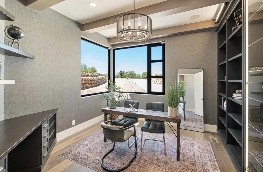 927 South Summit Creek Drive Home in Woodland Hills, Utah. Step into your custom dream home in Summit Creek, offering luxury living and unparalleled natural beauty. This magnificent residence, spanning 8,043 square feet on a .90-acre lot, presents stunning views of mountains and valleys. Floor-to-ceiling windows bathe the open-concept interior in natural light and provide uninterrupted scenic views. 
