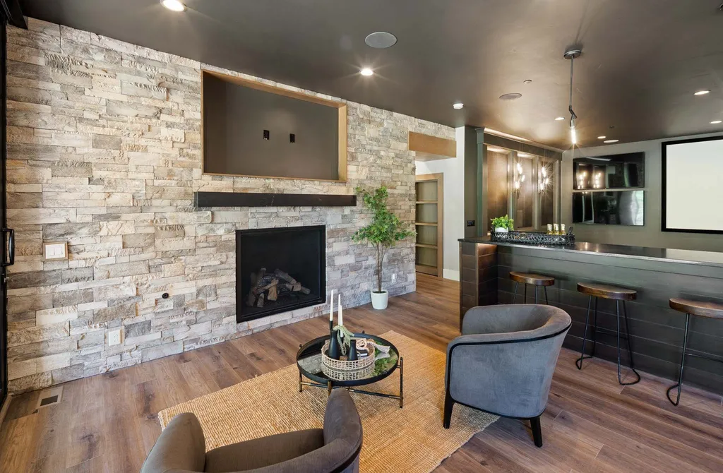 927 South Summit Creek Drive Home in Woodland Hills, Utah. Step into your custom dream home in Summit Creek, offering luxury living and unparalleled natural beauty. This magnificent residence, spanning 8,043 square feet on a .90-acre lot, presents stunning views of mountains and valleys. Floor-to-ceiling windows bathe the open-concept interior in natural light and provide uninterrupted scenic views. 