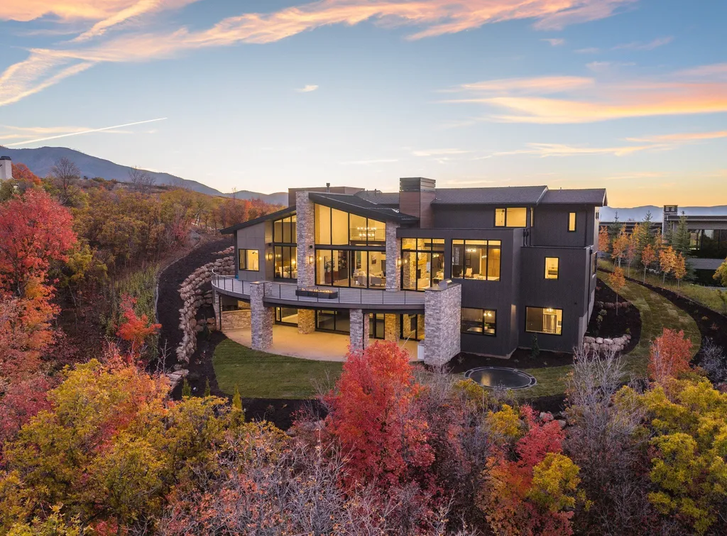 927 South Summit Creek Drive Home in Woodland Hills, Utah. Step into your custom dream home in Summit Creek, offering luxury living and unparalleled natural beauty. This magnificent residence, spanning 8,043 square feet on a .90-acre lot, presents stunning views of mountains and valleys. Floor-to-ceiling windows bathe the open-concept interior in natural light and provide uninterrupted scenic views. 
