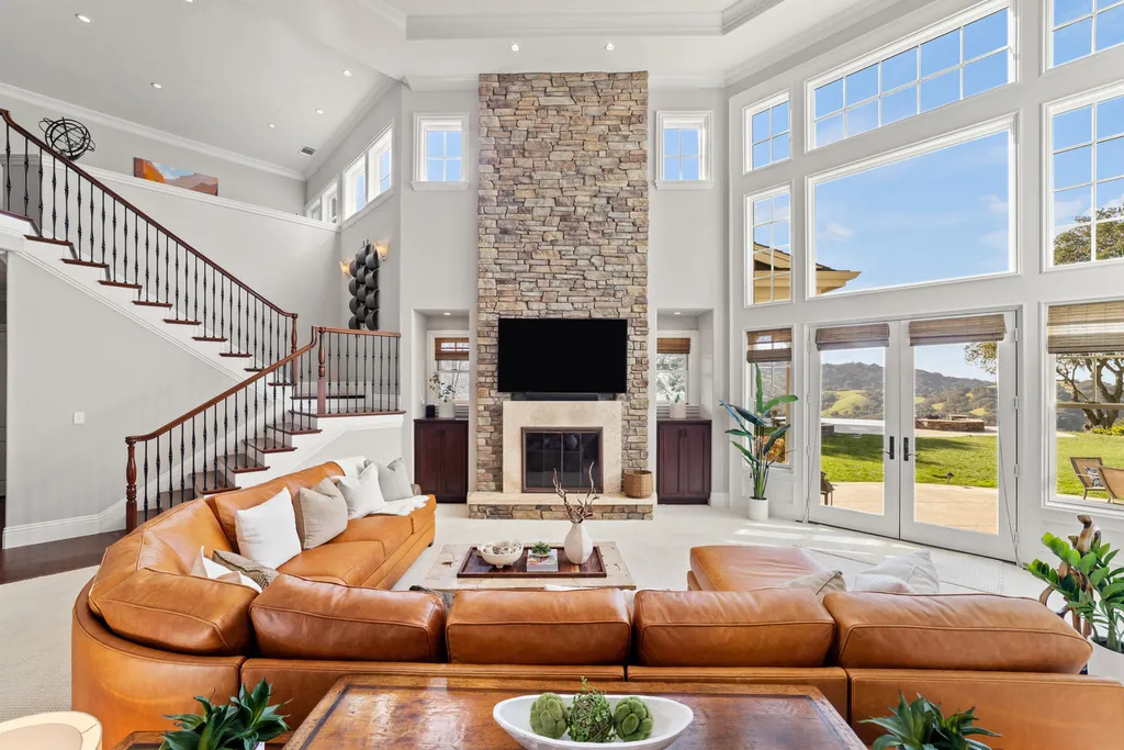 9767 Santos Ranch Road Home in Pleasanton, California. Experience the epitome of wine country living in this 4700+ SF luxury residence by Prodigy Real Estate. Boasting 4 bedrooms, 5 bathrooms, an office, and impeccable craftsmanship, this home offers a thoughtfully designed floor plan, soaring ceilings, and expansive windows to capture panoramic views. 