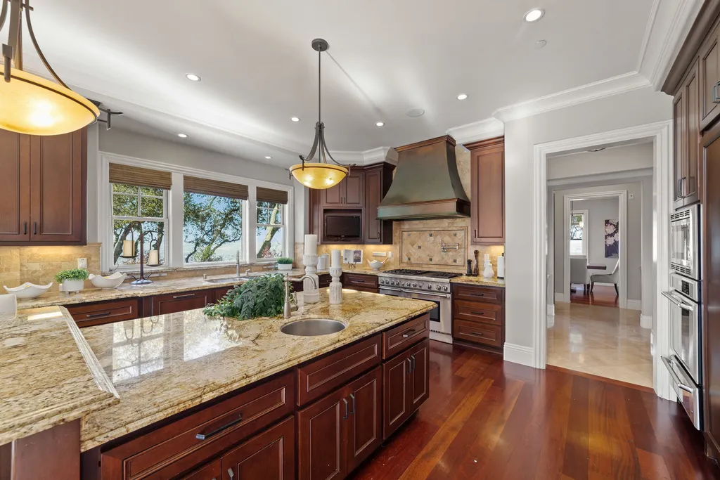9767 Santos Ranch Road Home in Pleasanton, California. Experience the epitome of wine country living in this 4700+ SF luxury residence by Prodigy Real Estate. Boasting 4 bedrooms, 5 bathrooms, an office, and impeccable craftsmanship, this home offers a thoughtfully designed floor plan, soaring ceilings, and expansive windows to capture panoramic views. 