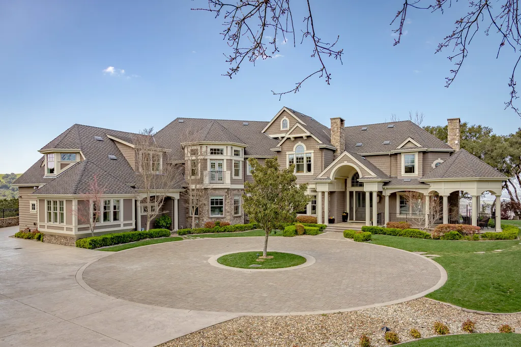 9767 Santos Ranch Road Home in Pleasanton, California. Experience the epitome of wine country living in this 4700+ SF luxury residence by Prodigy Real Estate. Boasting 4 bedrooms, 5 bathrooms, an office, and impeccable craftsmanship, this home offers a thoughtfully designed floor plan, soaring ceilings, and expansive windows to capture panoramic views. 