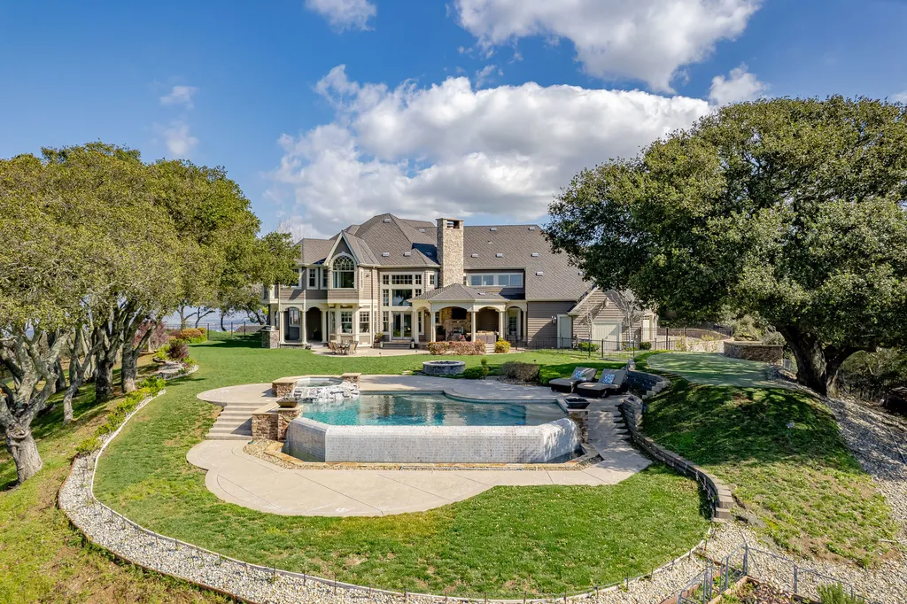 9767 Santos Ranch Road Home in Pleasanton, California. Experience the epitome of wine country living in this 4700+ SF luxury residence by Prodigy Real Estate. Boasting 4 bedrooms, 5 bathrooms, an office, and impeccable craftsmanship, this home offers a thoughtfully designed floor plan, soaring ceilings, and expansive windows to capture panoramic views. 