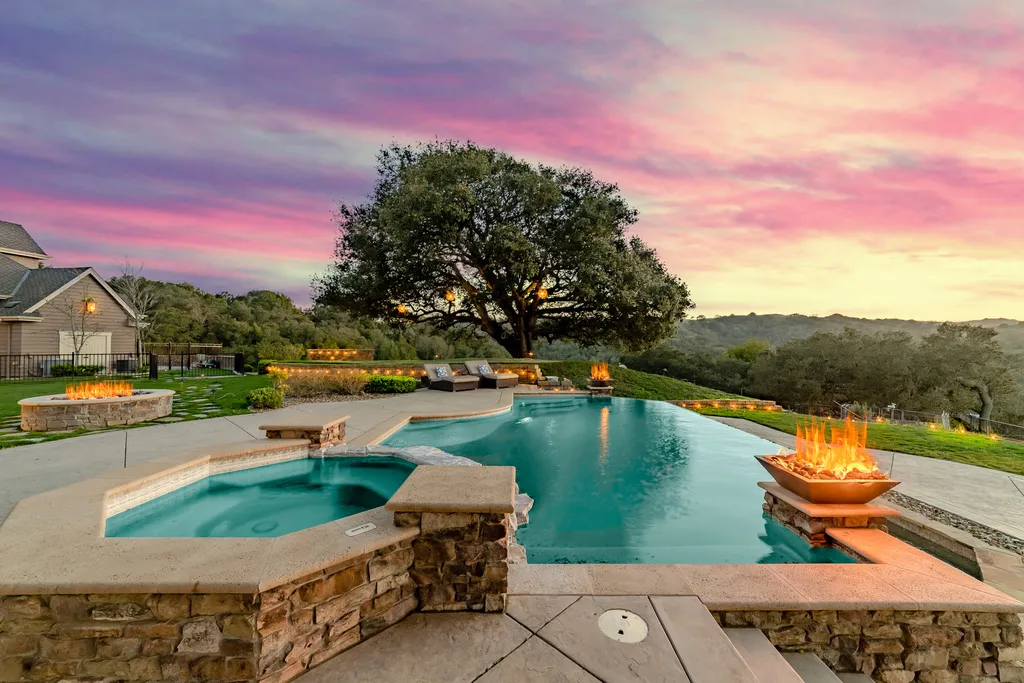9767 Santos Ranch Road Home in Pleasanton, California. Experience the epitome of wine country living in this 4700+ SF luxury residence by Prodigy Real Estate. Boasting 4 bedrooms, 5 bathrooms, an office, and impeccable craftsmanship, this home offers a thoughtfully designed floor plan, soaring ceilings, and expansive windows to capture panoramic views. 