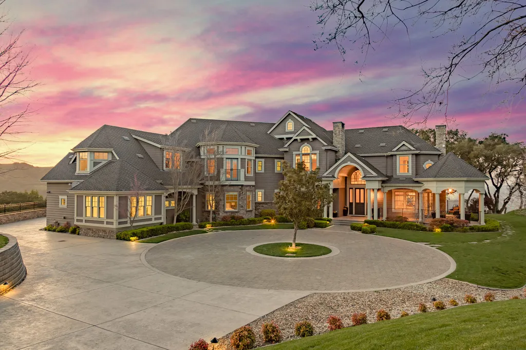 9767 Santos Ranch Road Home in Pleasanton, California. Experience the epitome of wine country living in this 4700+ SF luxury residence by Prodigy Real Estate. Boasting 4 bedrooms, 5 bathrooms, an office, and impeccable craftsmanship, this home offers a thoughtfully designed floor plan, soaring ceilings, and expansive windows to capture panoramic views. 
