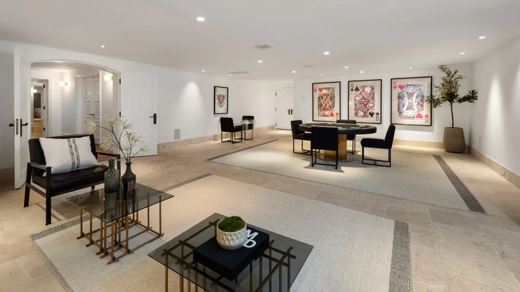 9904 Kip Drive Home in Beverly Hills, California. Enter the world of opulence and exclusivity with this celebrity compound behind gated privacy. Designed by KAA Associates, the 25,000 SF estate boasts 7 bedrooms, 13 bathrooms, lush gardens, and stunning canyon, city, and ocean views. 
