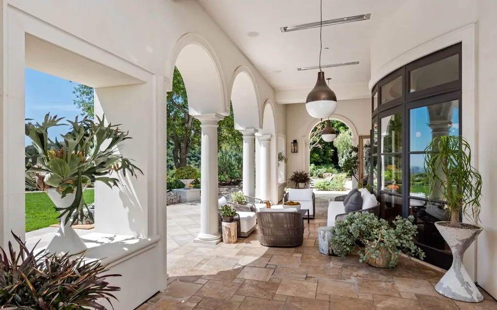 9904 Kip Drive Home in Beverly Hills, California. Enter the world of opulence and exclusivity with this celebrity compound behind gated privacy. Designed by KAA Associates, the 25,000 SF estate boasts 7 bedrooms, 13 bathrooms, lush gardens, and stunning canyon, city, and ocean views. 