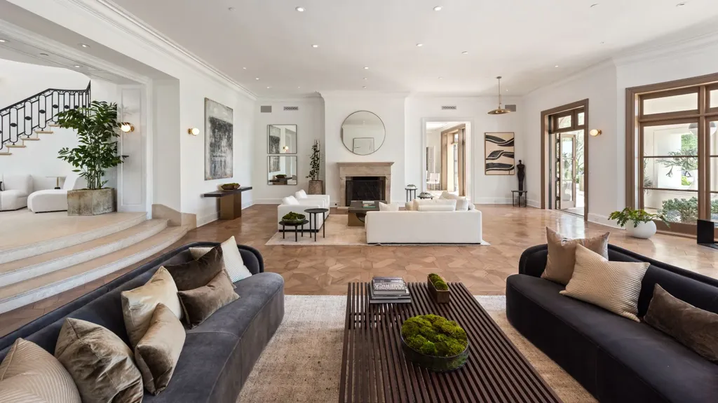 9904 Kip Drive Home in Beverly Hills, California. Enter the world of opulence and exclusivity with this celebrity compound behind gated privacy. Designed by KAA Associates, the 25,000 SF estate boasts 7 bedrooms, 13 bathrooms, lush gardens, and stunning canyon, city, and ocean views. 