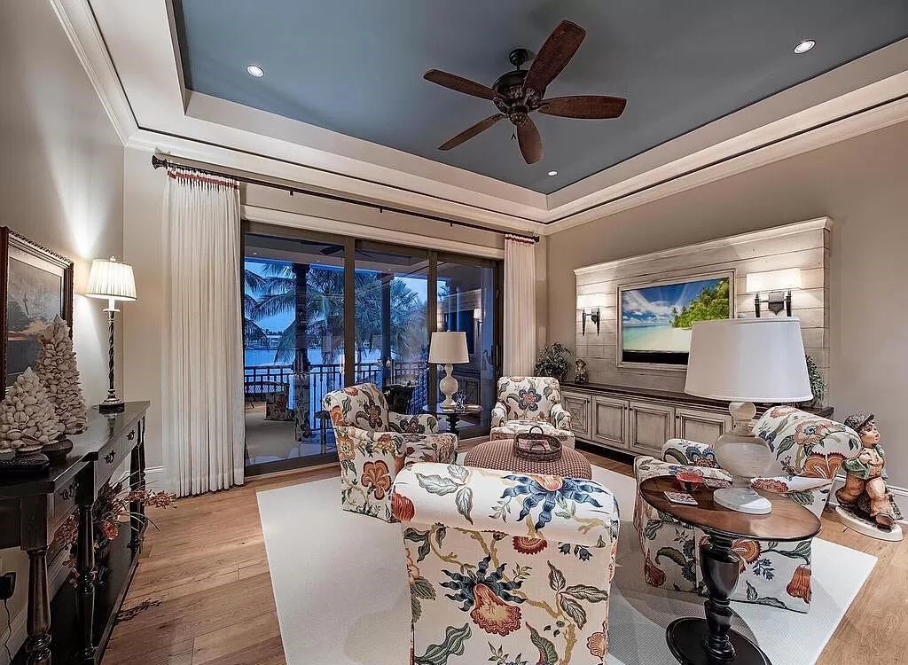 Discover an unparalleled living experience at 960 17th Ave S, Naples, Florida, where luxury meets breathtaking natural beauty. This extraordinary estate spans approximately 1.12 acres, offering 340 feet of waterfrontage with unobstructed bay views.