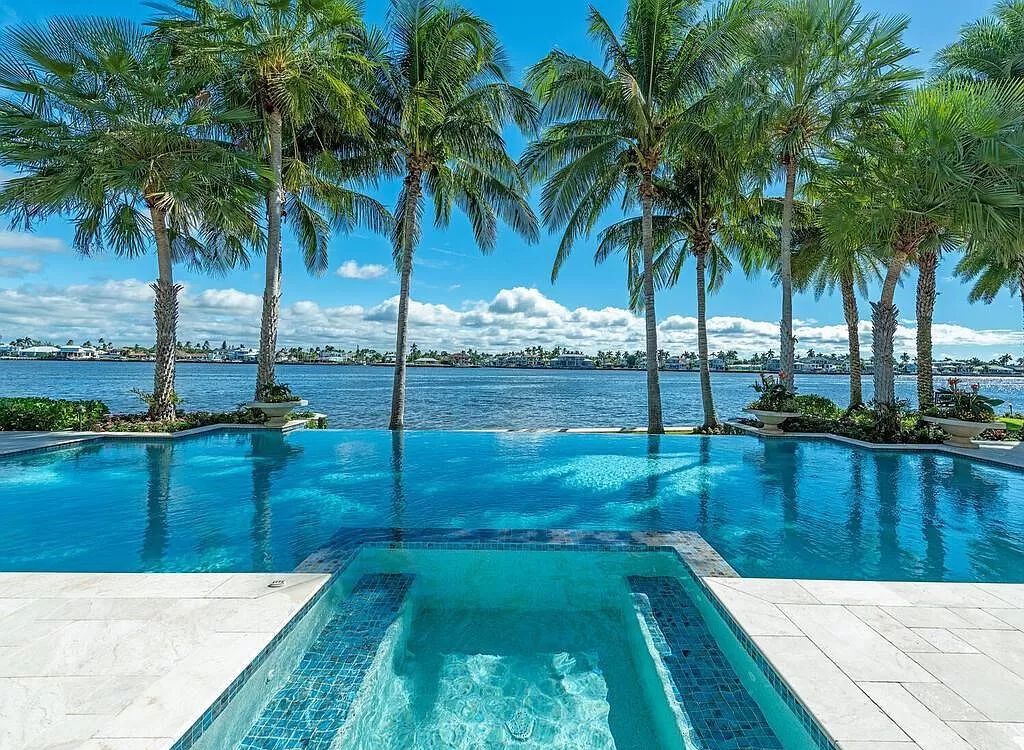 Discover an unparalleled living experience at 960 17th Ave S, Naples, Florida, where luxury meets breathtaking natural beauty. This extraordinary estate spans approximately 1.12 acres, offering 340 feet of waterfrontage with unobstructed bay views.