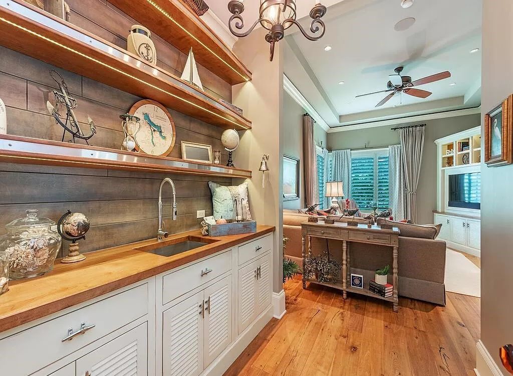 Discover an unparalleled living experience at 960 17th Ave S, Naples, Florida, where luxury meets breathtaking natural beauty. This extraordinary estate spans approximately 1.12 acres, offering 340 feet of waterfrontage with unobstructed bay views.