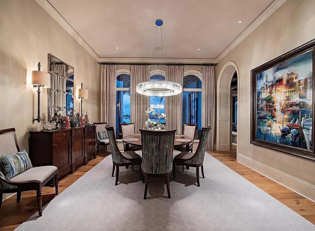 Discover an unparalleled living experience at 960 17th Ave S, Naples, Florida, where luxury meets breathtaking natural beauty. This extraordinary estate spans approximately 1.12 acres, offering 340 feet of waterfrontage with unobstructed bay views.