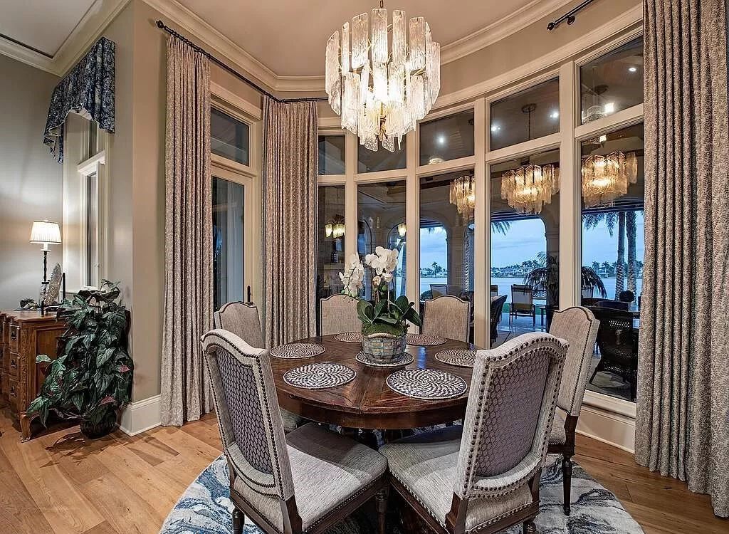 Discover an unparalleled living experience at 960 17th Ave S, Naples, Florida, where luxury meets breathtaking natural beauty. This extraordinary estate spans approximately 1.12 acres, offering 340 feet of waterfrontage with unobstructed bay views.