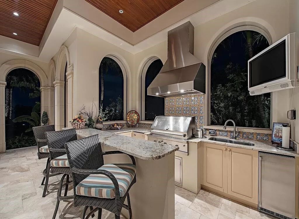 Discover an unparalleled living experience at 960 17th Ave S, Naples, Florida, where luxury meets breathtaking natural beauty. This extraordinary estate spans approximately 1.12 acres, offering 340 feet of waterfrontage with unobstructed bay views.