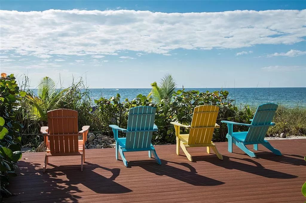 Welcome to 8250 Sanderling Road, a stunning contemporary masterpiece by renowned architect Guy Peterson FAIA, nestled within the exclusive Sanderling Club on Siesta Key. This award-winning property boasts a striking exterior composed of interconnected pavilions, recognized for its architectural excellence by the Florida Gulf Coast Chapter of the AIA and featured in prestigious publications like HGTV Homes Across America