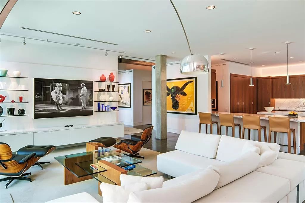 Welcome to 8250 Sanderling Road, a stunning contemporary masterpiece by renowned architect Guy Peterson FAIA, nestled within the exclusive Sanderling Club on Siesta Key. This award-winning property boasts a striking exterior composed of interconnected pavilions, recognized for its architectural excellence by the Florida Gulf Coast Chapter of the AIA and featured in prestigious publications like HGTV Homes Across America