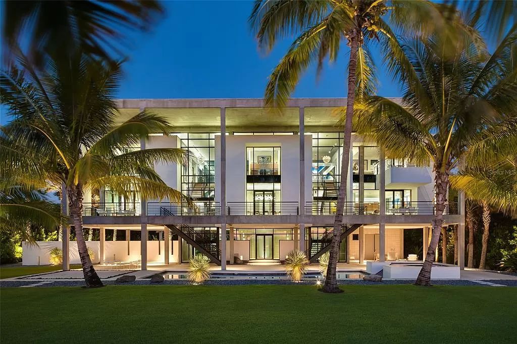 Welcome to 8250 Sanderling Road, a stunning contemporary masterpiece by renowned architect Guy Peterson FAIA, nestled within the exclusive Sanderling Club on Siesta Key. This award-winning property boasts a striking exterior composed of interconnected pavilions, recognized for its architectural excellence by the Florida Gulf Coast Chapter of the AIA and featured in prestigious publications like HGTV Homes Across America