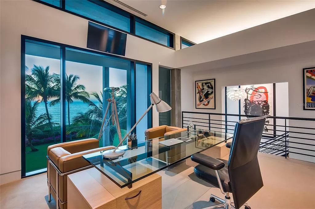 Welcome to 8250 Sanderling Road, a stunning contemporary masterpiece by renowned architect Guy Peterson FAIA, nestled within the exclusive Sanderling Club on Siesta Key. This award-winning property boasts a striking exterior composed of interconnected pavilions, recognized for its architectural excellence by the Florida Gulf Coast Chapter of the AIA and featured in prestigious publications like HGTV Homes Across America