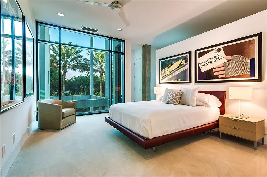 Welcome to 8250 Sanderling Road, a stunning contemporary masterpiece by renowned architect Guy Peterson FAIA, nestled within the exclusive Sanderling Club on Siesta Key. This award-winning property boasts a striking exterior composed of interconnected pavilions, recognized for its architectural excellence by the Florida Gulf Coast Chapter of the AIA and featured in prestigious publications like HGTV Homes Across America