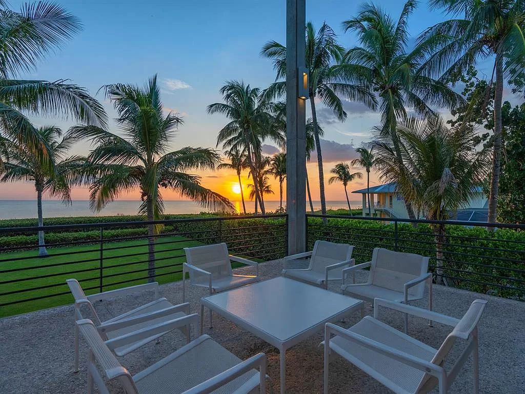 Welcome to 8250 Sanderling Road, a stunning contemporary masterpiece by renowned architect Guy Peterson FAIA, nestled within the exclusive Sanderling Club on Siesta Key. This award-winning property boasts a striking exterior composed of interconnected pavilions, recognized for its architectural excellence by the Florida Gulf Coast Chapter of the AIA and featured in prestigious publications like HGTV Homes Across America