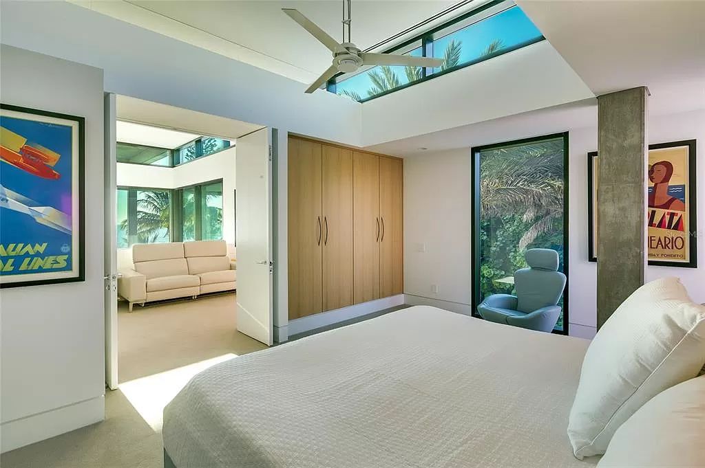 Welcome to 8250 Sanderling Road, a stunning contemporary masterpiece by renowned architect Guy Peterson FAIA, nestled within the exclusive Sanderling Club on Siesta Key. This award-winning property boasts a striking exterior composed of interconnected pavilions, recognized for its architectural excellence by the Florida Gulf Coast Chapter of the AIA and featured in prestigious publications like HGTV Homes Across America