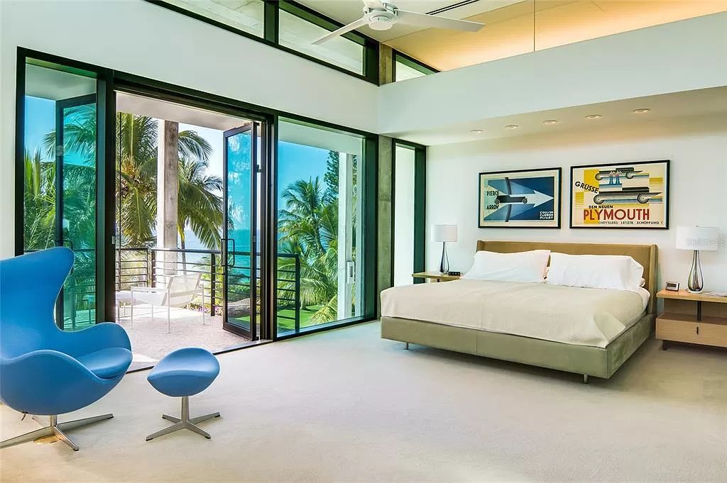 Welcome to 8250 Sanderling Road, a stunning contemporary masterpiece by renowned architect Guy Peterson FAIA, nestled within the exclusive Sanderling Club on Siesta Key. This award-winning property boasts a striking exterior composed of interconnected pavilions, recognized for its architectural excellence by the Florida Gulf Coast Chapter of the AIA and featured in prestigious publications like HGTV Homes Across America