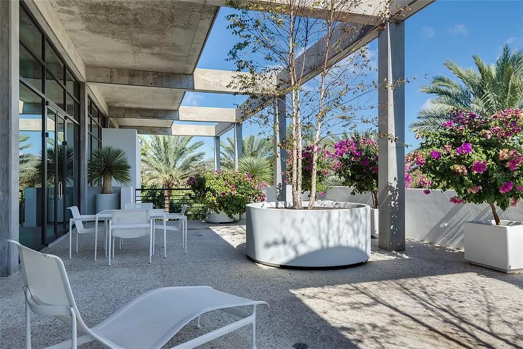 Welcome to 8250 Sanderling Road, a stunning contemporary masterpiece by renowned architect Guy Peterson FAIA, nestled within the exclusive Sanderling Club on Siesta Key. This award-winning property boasts a striking exterior composed of interconnected pavilions, recognized for its architectural excellence by the Florida Gulf Coast Chapter of the AIA and featured in prestigious publications like HGTV Homes Across America