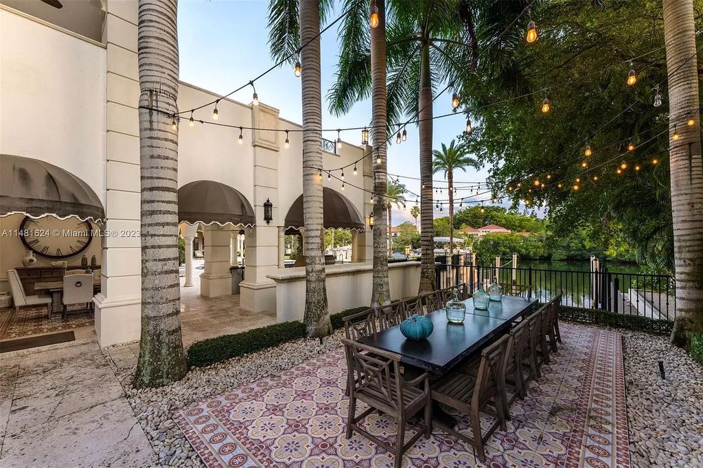 Indulge in the pinnacle of waterfront luxury at 150 Edgewater Drive, Coral Gables. This Mediterranean-style estate, nestled on prestigious Edgewater Drive, boasts 180 feet of deep-water frontage, an 80-foot inlet slip, and direct bay access - a paradise for boating enthusiasts.