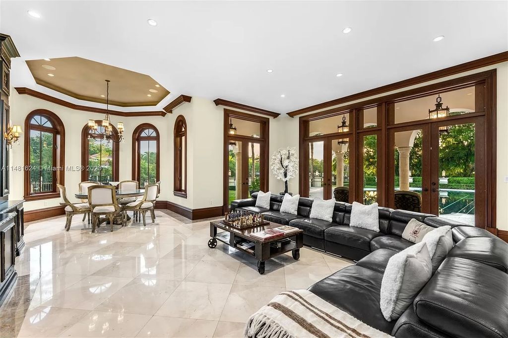 Indulge in the pinnacle of waterfront luxury at 150 Edgewater Drive, Coral Gables. This Mediterranean-style estate, nestled on prestigious Edgewater Drive, boasts 180 feet of deep-water frontage, an 80-foot inlet slip, and direct bay access - a paradise for boating enthusiasts.