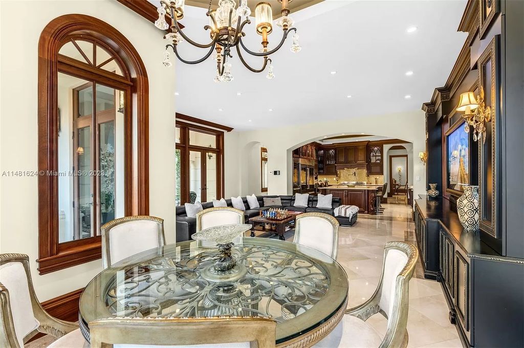 Indulge in the pinnacle of waterfront luxury at 150 Edgewater Drive, Coral Gables. This Mediterranean-style estate, nestled on prestigious Edgewater Drive, boasts 180 feet of deep-water frontage, an 80-foot inlet slip, and direct bay access - a paradise for boating enthusiasts.