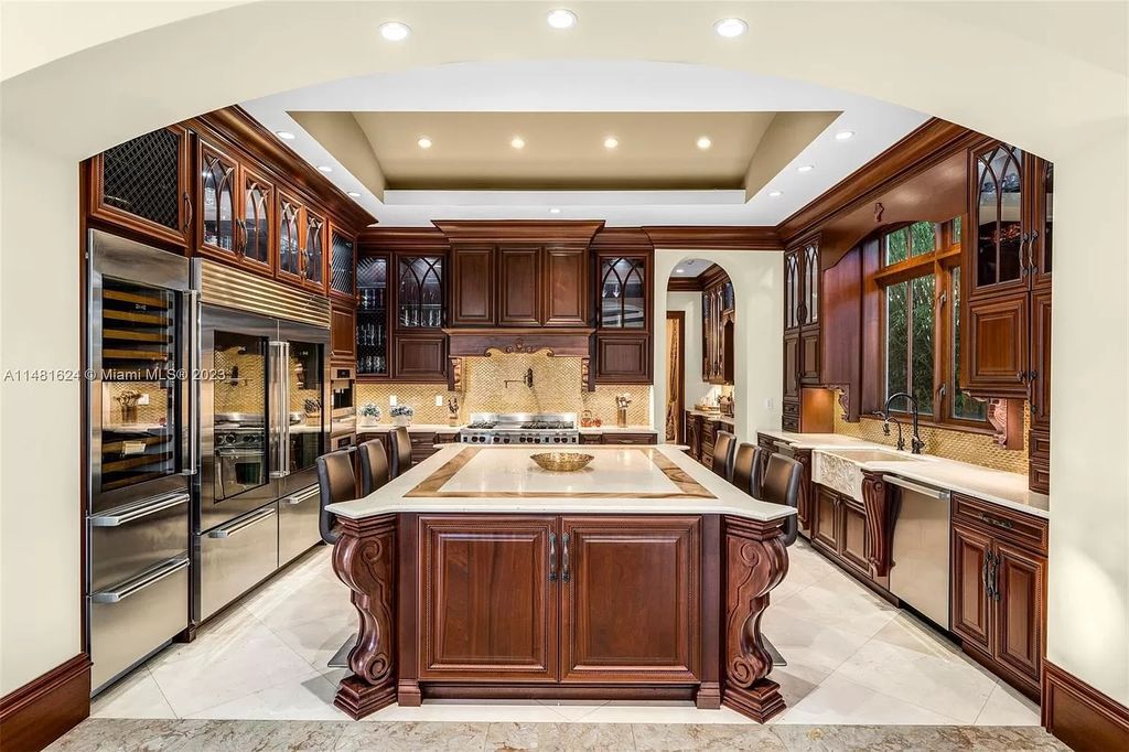 Indulge in the pinnacle of waterfront luxury at 150 Edgewater Drive, Coral Gables. This Mediterranean-style estate, nestled on prestigious Edgewater Drive, boasts 180 feet of deep-water frontage, an 80-foot inlet slip, and direct bay access - a paradise for boating enthusiasts.