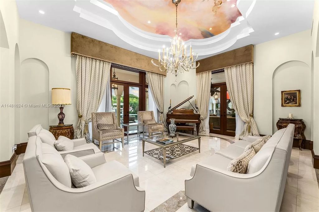 Indulge in the pinnacle of waterfront luxury at 150 Edgewater Drive, Coral Gables. This Mediterranean-style estate, nestled on prestigious Edgewater Drive, boasts 180 feet of deep-water frontage, an 80-foot inlet slip, and direct bay access - a paradise for boating enthusiasts.