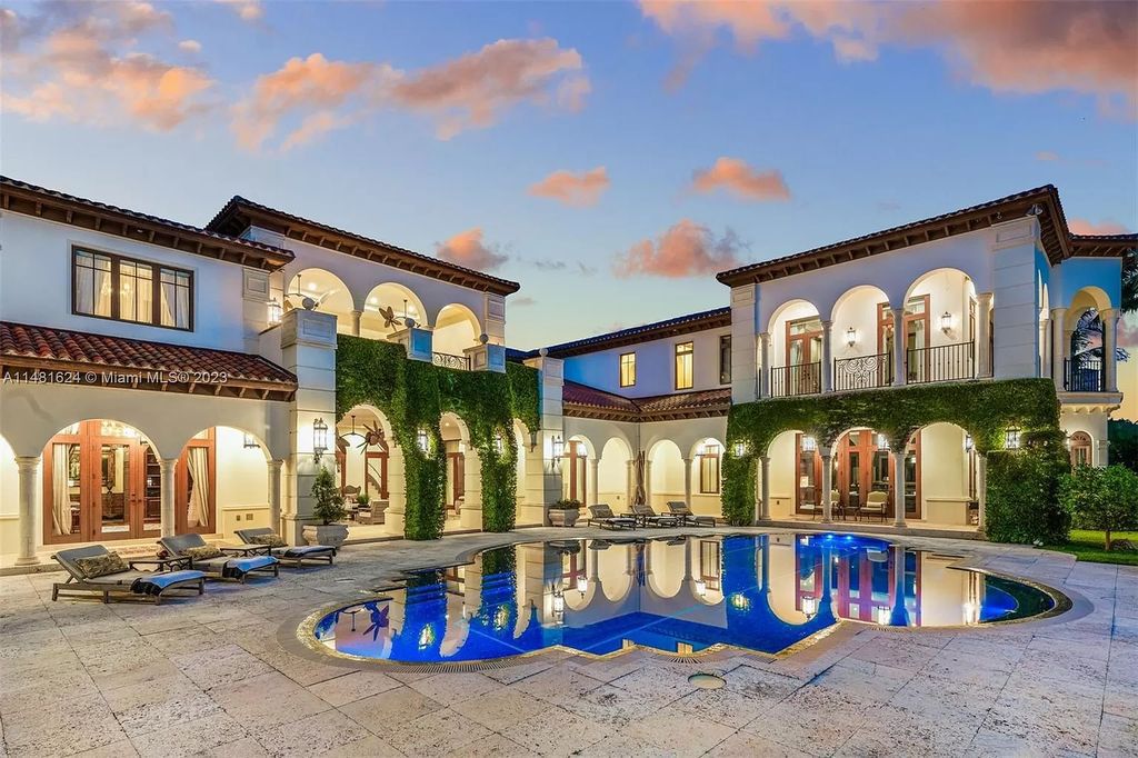 Indulge in the pinnacle of waterfront luxury at 150 Edgewater Drive, Coral Gables. This Mediterranean-style estate, nestled on prestigious Edgewater Drive, boasts 180 feet of deep-water frontage, an 80-foot inlet slip, and direct bay access - a paradise for boating enthusiasts.