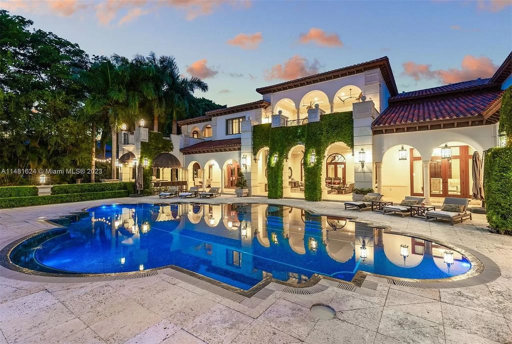Indulge in the pinnacle of waterfront luxury at 150 Edgewater Drive, Coral Gables. This Mediterranean-style estate, nestled on prestigious Edgewater Drive, boasts 180 feet of deep-water frontage, an 80-foot inlet slip, and direct bay access - a paradise for boating enthusiasts.