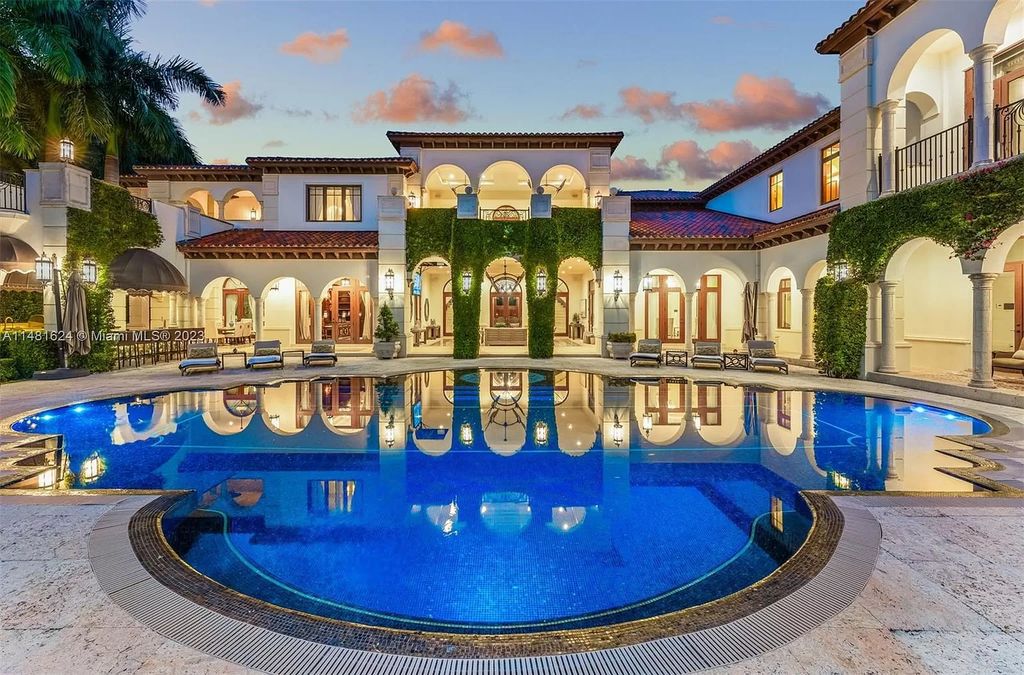 Indulge in the pinnacle of waterfront luxury at 150 Edgewater Drive, Coral Gables. This Mediterranean-style estate, nestled on prestigious Edgewater Drive, boasts 180 feet of deep-water frontage, an 80-foot inlet slip, and direct bay access - a paradise for boating enthusiasts.