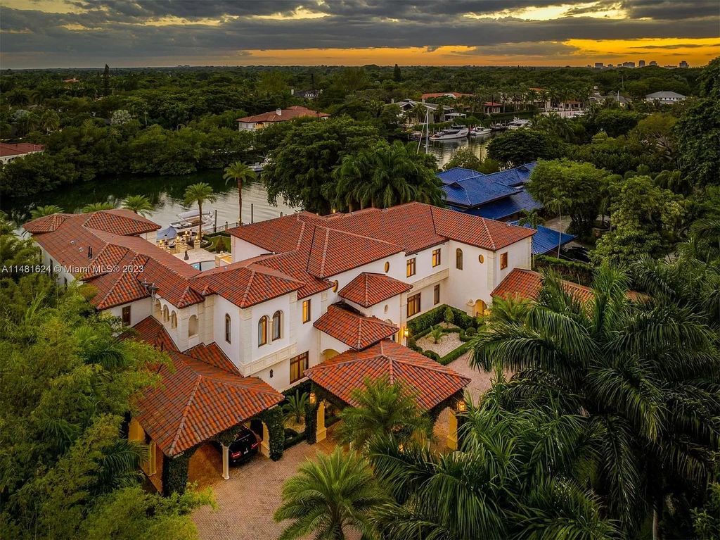 Indulge in the pinnacle of waterfront luxury at 150 Edgewater Drive, Coral Gables. This Mediterranean-style estate, nestled on prestigious Edgewater Drive, boasts 180 feet of deep-water frontage, an 80-foot inlet slip, and direct bay access - a paradise for boating enthusiasts.