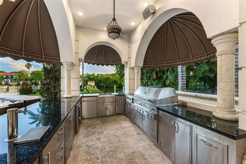 Indulge in the pinnacle of waterfront luxury at 150 Edgewater Drive, Coral Gables. This Mediterranean-style estate, nestled on prestigious Edgewater Drive, boasts 180 feet of deep-water frontage, an 80-foot inlet slip, and direct bay access - a paradise for boating enthusiasts.